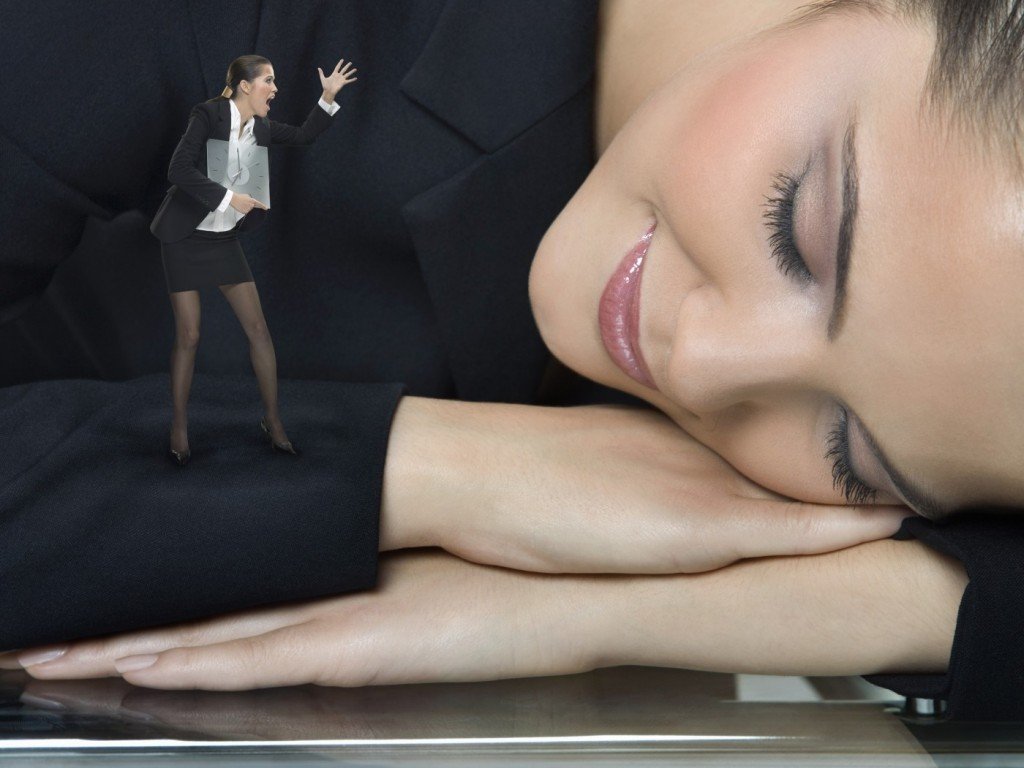 Businesswoman sleeping at work